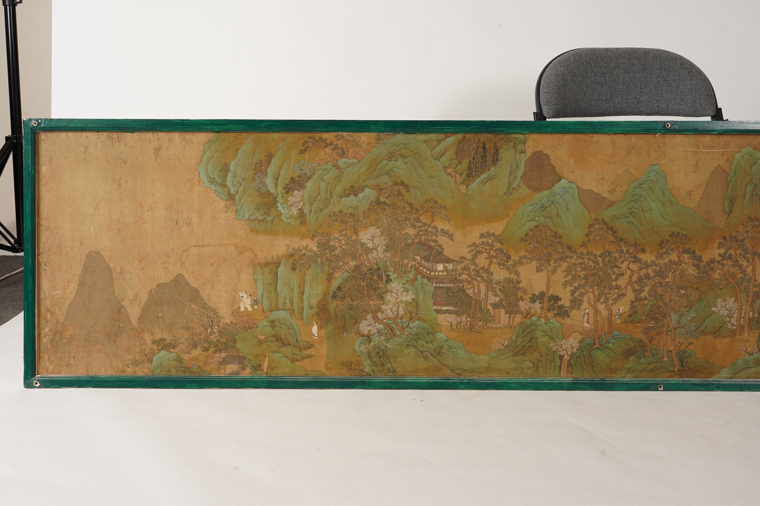 Chinese School , 17th century or earlier, Scholars in a mountainous river landscape scene with pavilions, Ink and colour on silk, incomplete clerical script signature, 54cm x 290cm